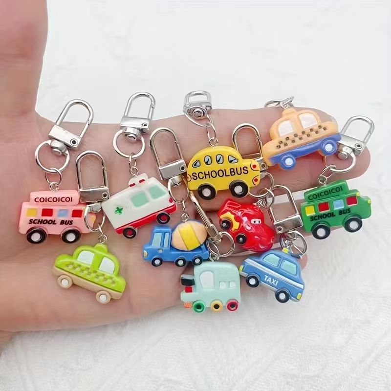 Luggage - 10 stuks hars cartoon autosleutelhanger, geschikt
